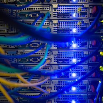 Interior of server with wires blue close up in data center